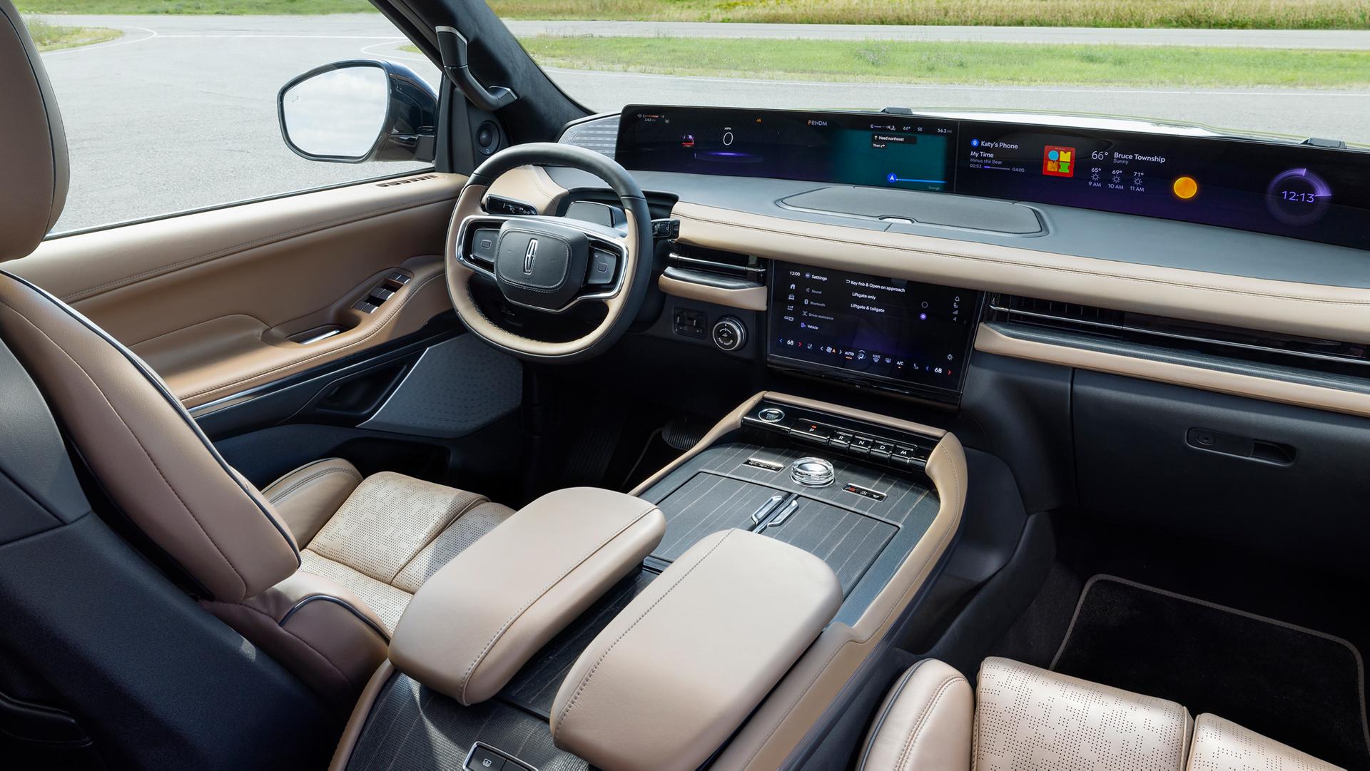 An angled shot of the interior front of a 2026 Lincoln Black Label with the Enlighten theme