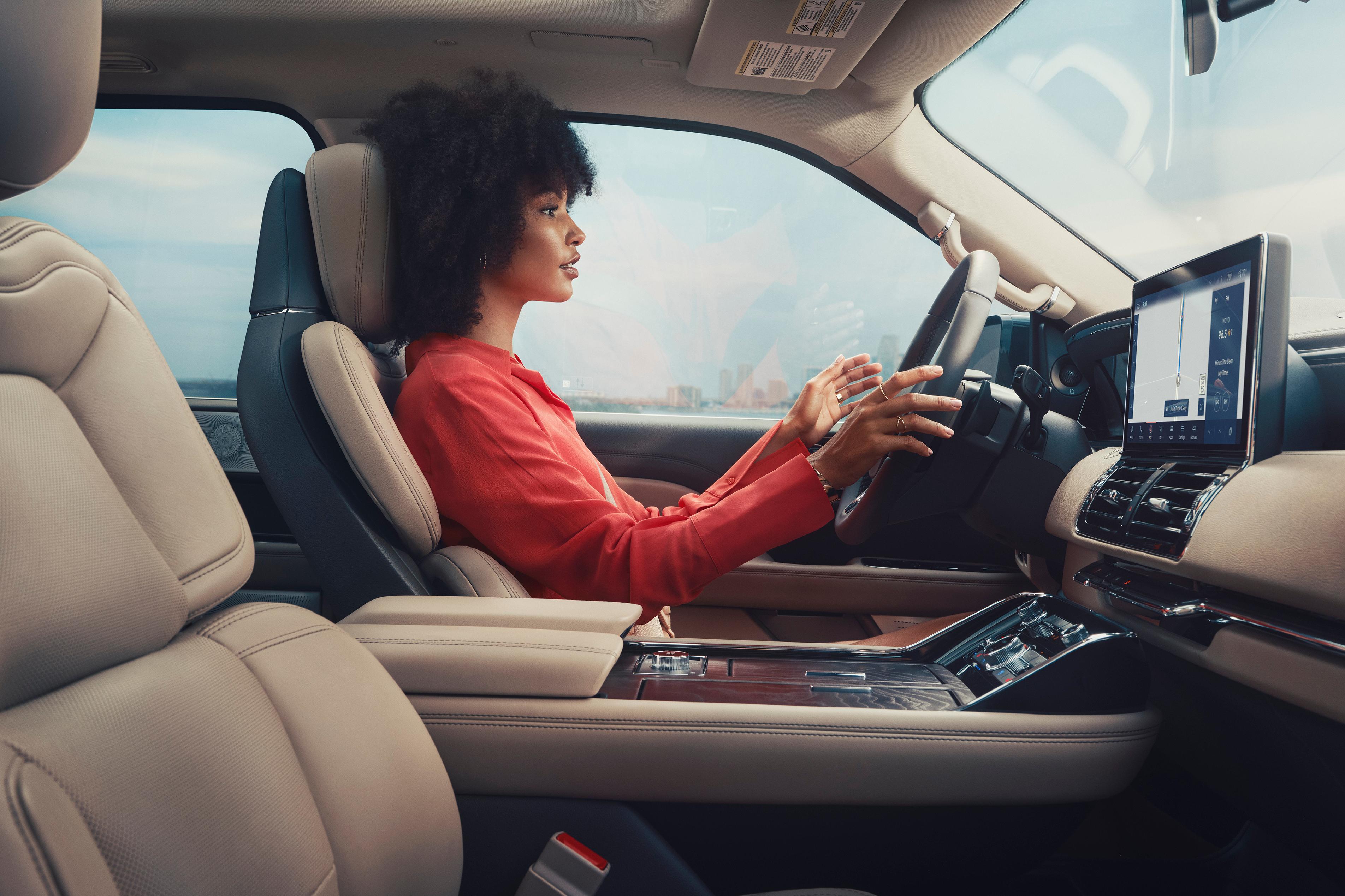 Woman in a Lincoln vehicle utilizing BlueCruise technology
