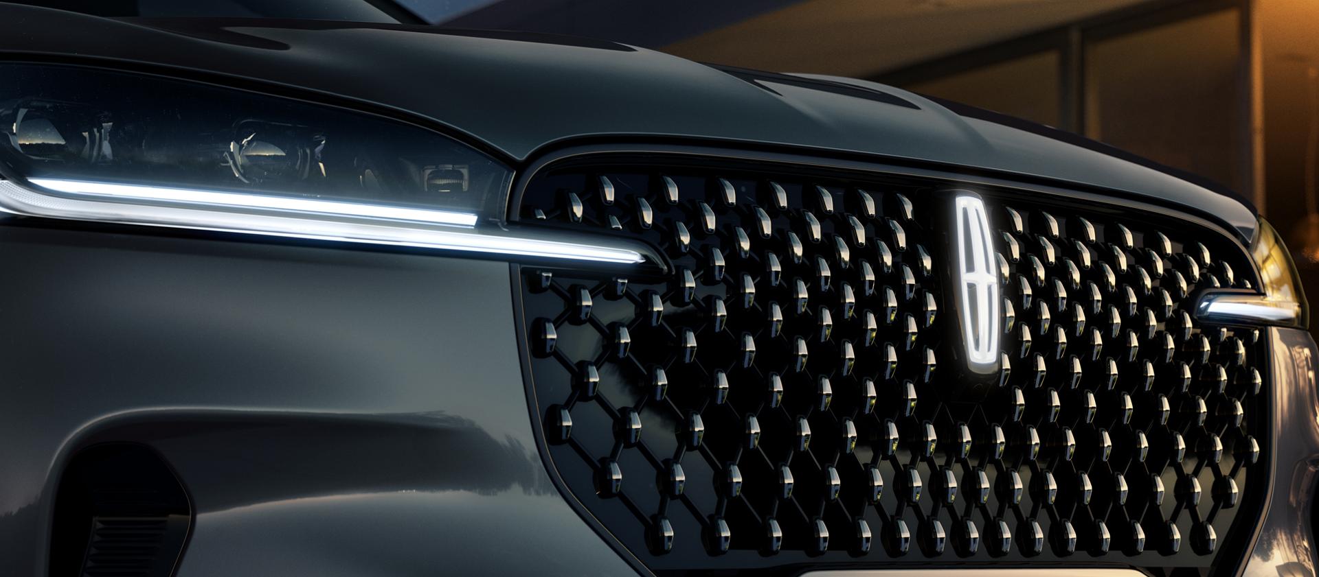 A Lincoln Star logo glows in the centre of the grille on a 2027 Lincoln Aviator® Black Label®