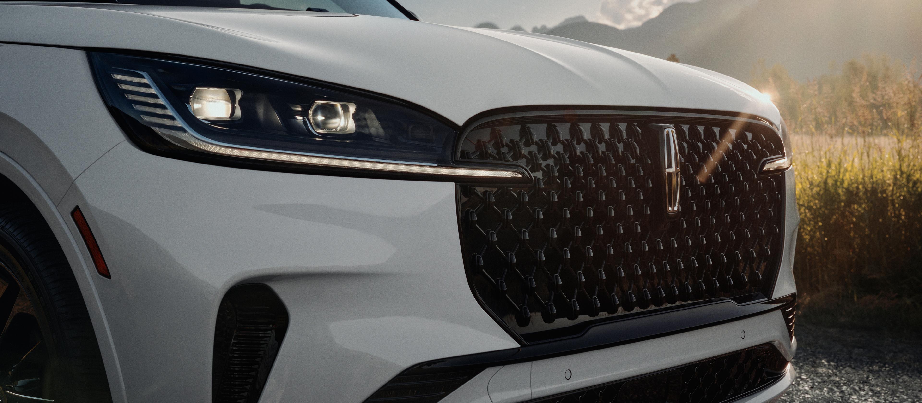 The Auto High Beam Headlamps of a 2026 Lincoln Aviator are illuminated