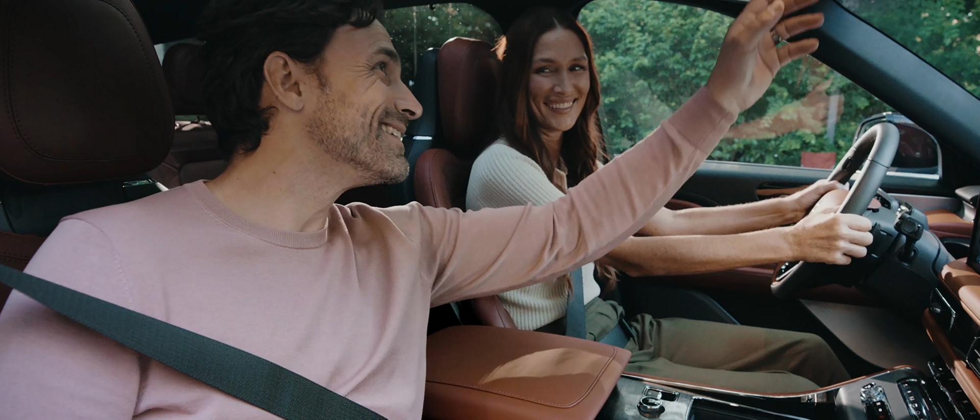 A couple sits in the front seats of a 2026 Lincoln Aviator