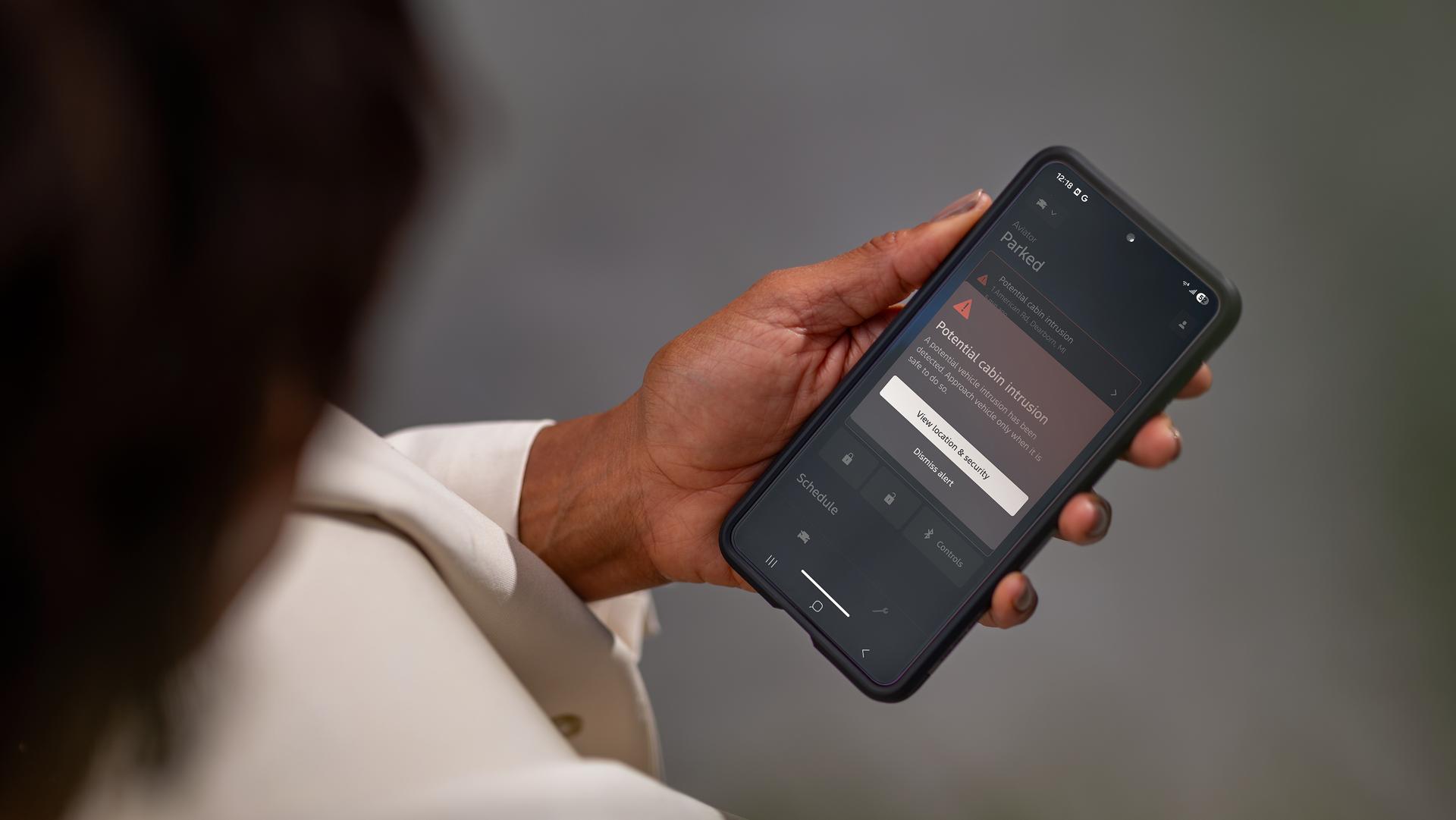 A woman holding her smartphone