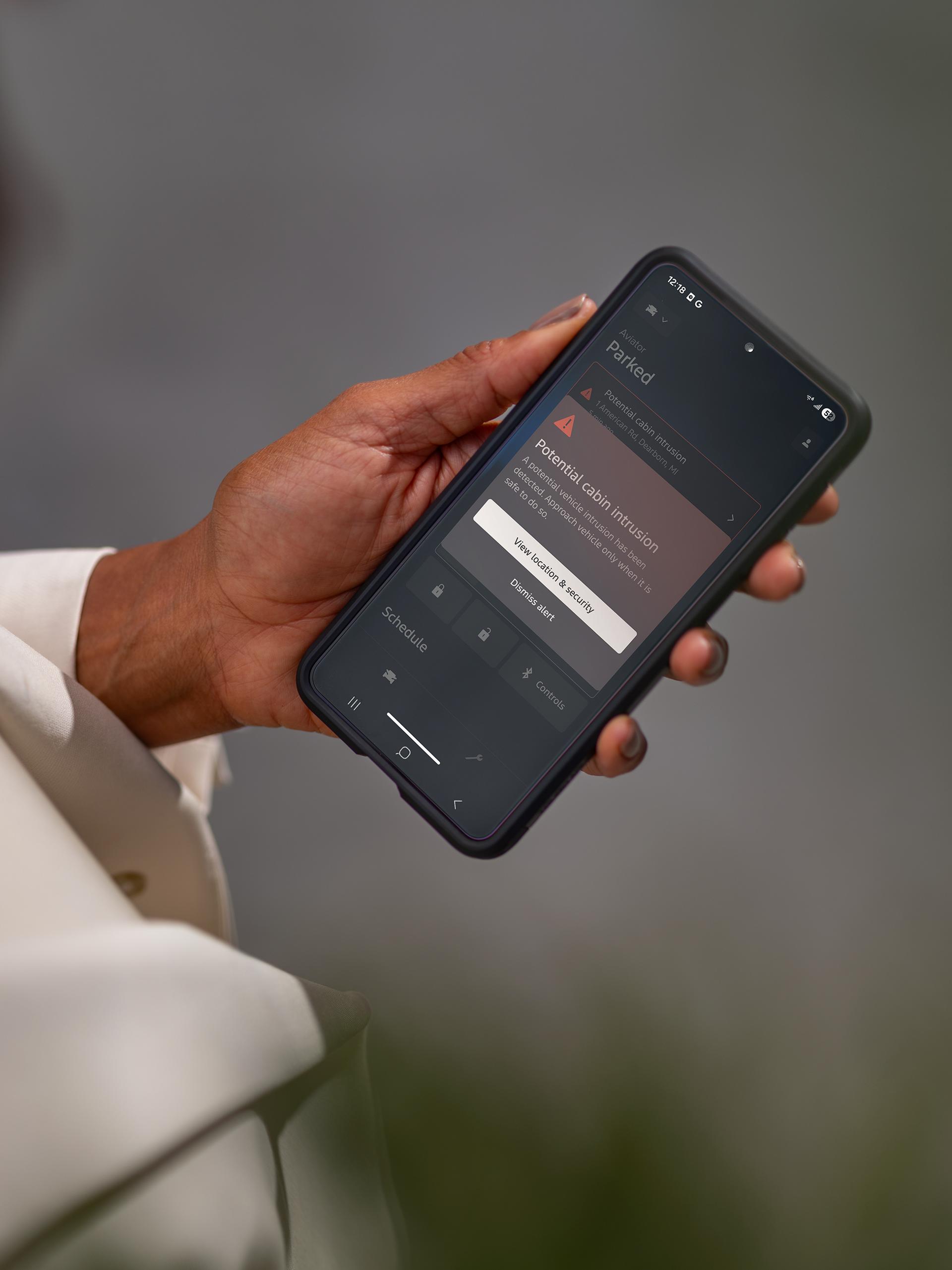 A woman holding her smartphone