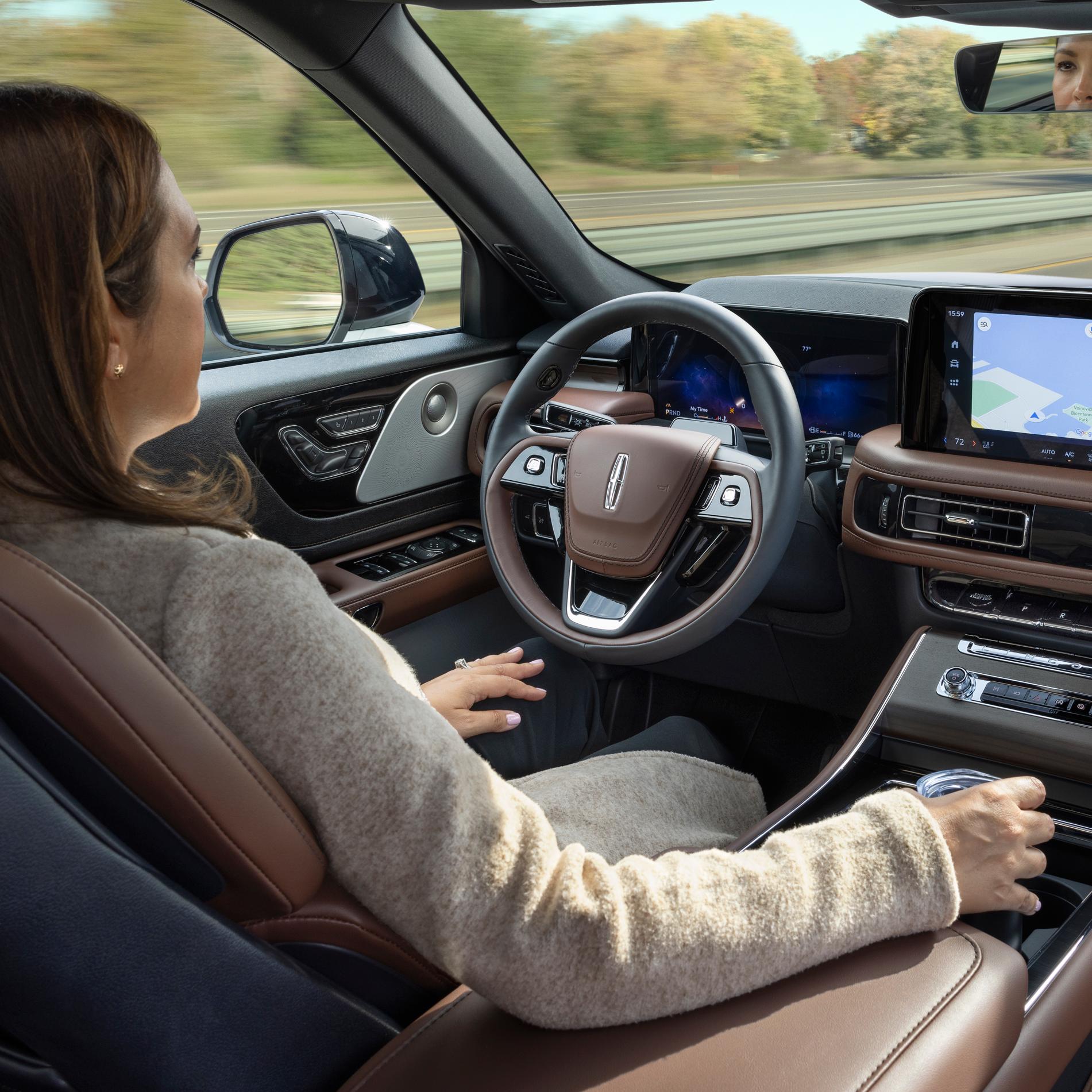 A 2026 Lincoln Aviator® SUV is being driven hands-free on a highway