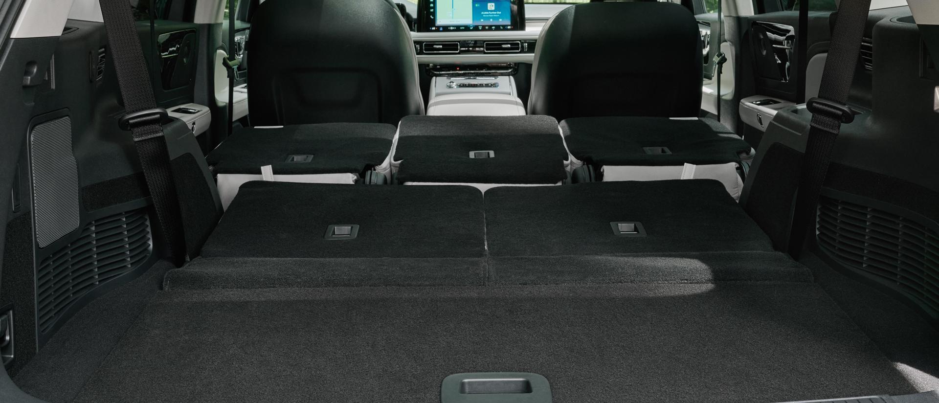 The full cabin of a 2027 Lincoln Aviator® is shown through the opened rear lift gate