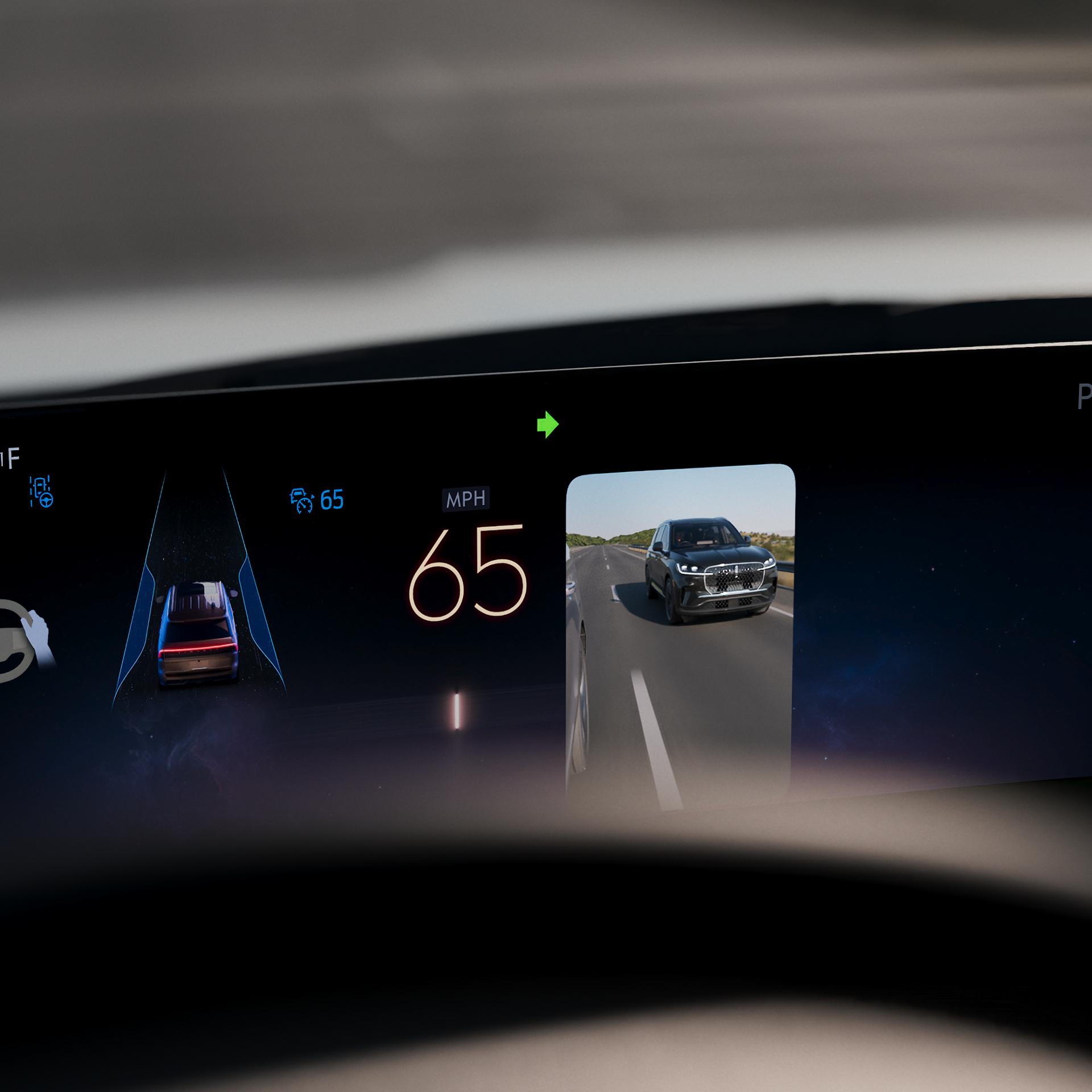 The panoramic display of the 2027 Lincoln Navigator® SUV shows the side camera that enables Turn Signal View