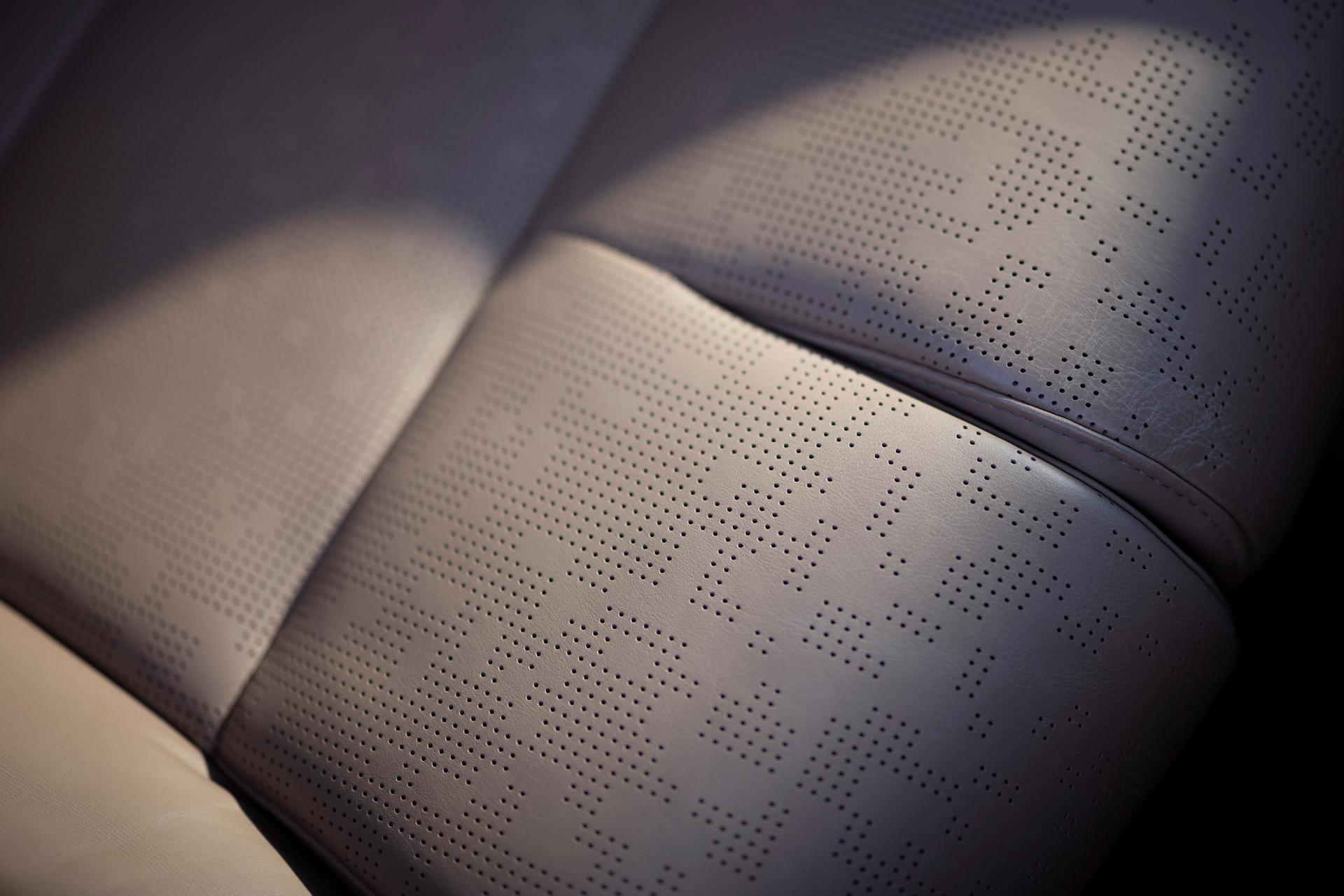 A close up of the perforated patterned seat of a 2026 Lincoln Black Label Navigator® with the Enlighten theme
