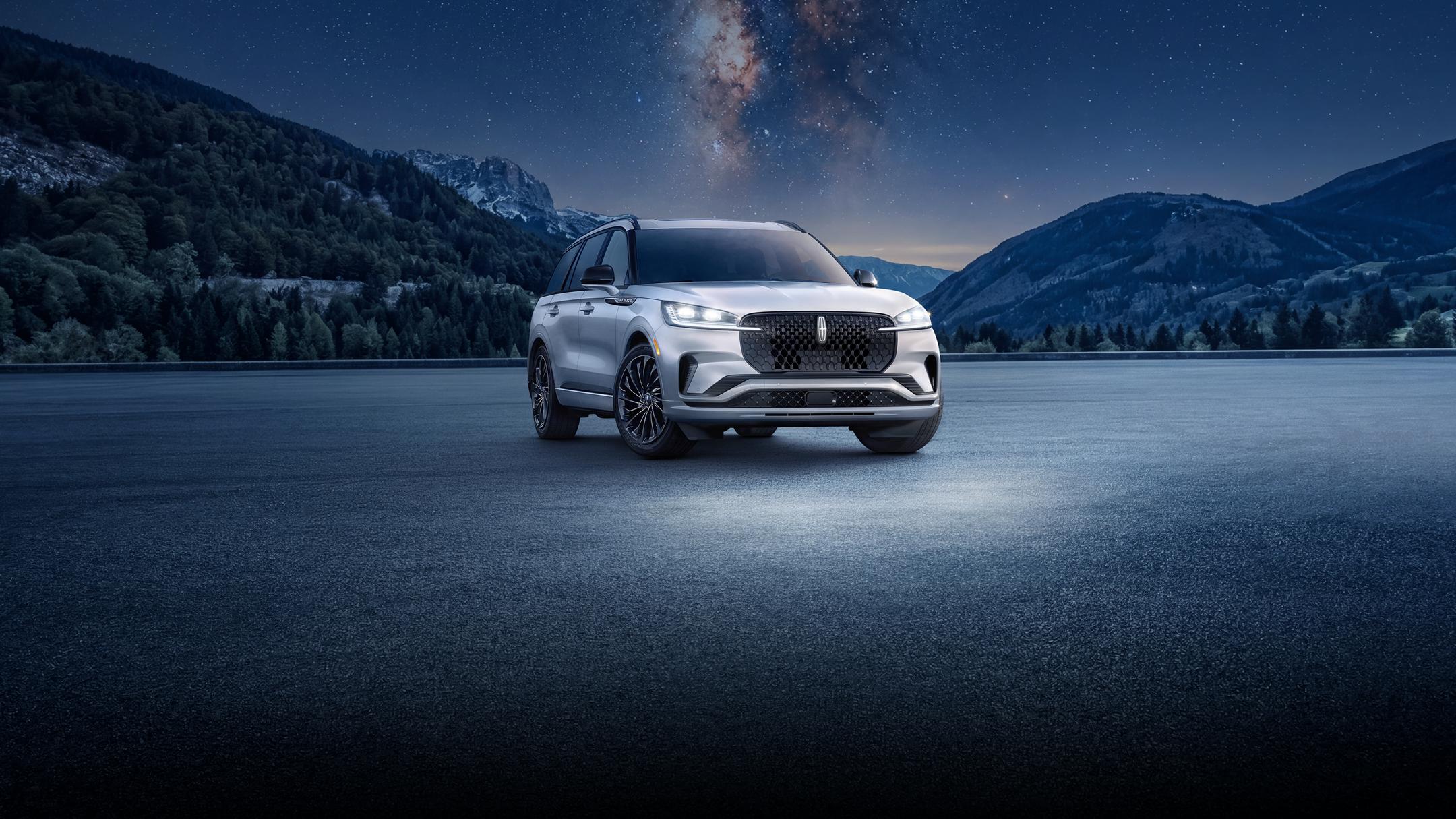 2026 Lincoln Aviator luxury SUV under a starry night sky.