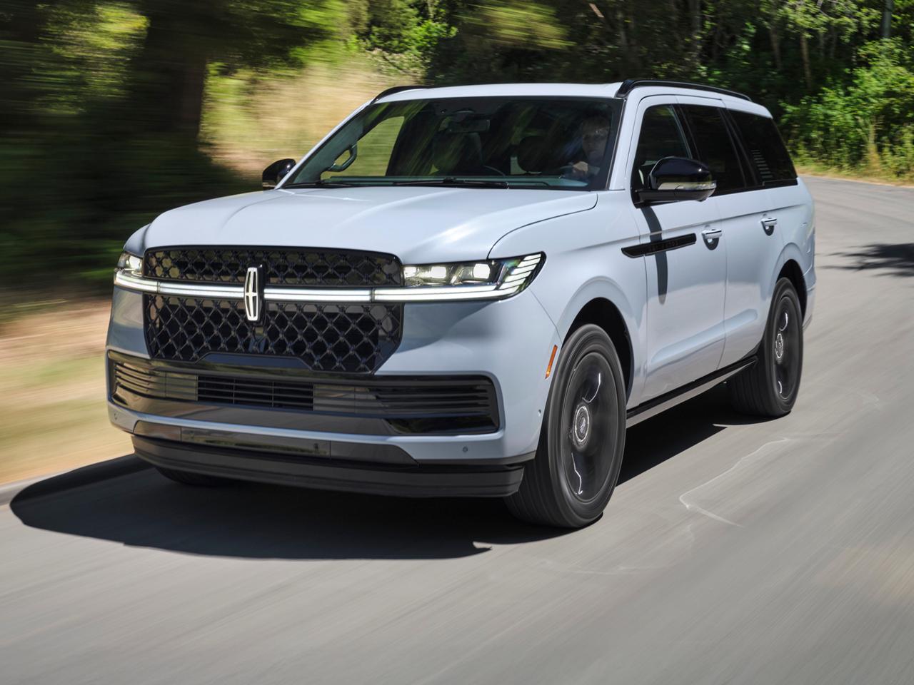 The Lincoln Navigator driving down the road.