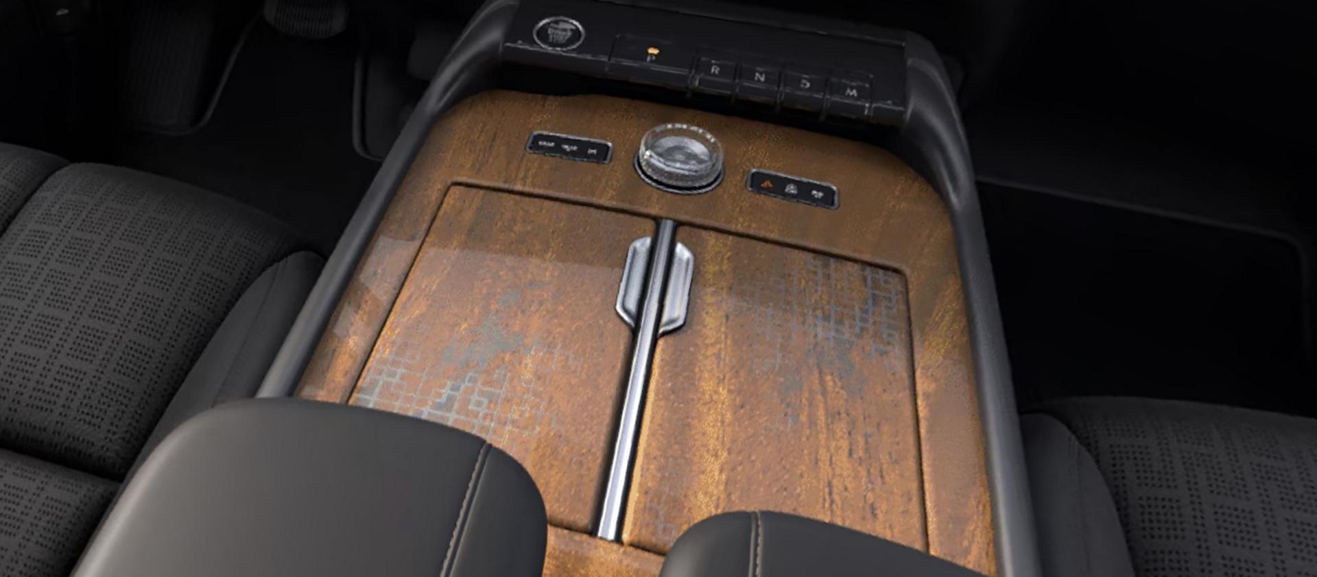 Khaya real-wood appliqué of the Invitation theme on the centre console of a 2027 Navigator® Lincoln Black Label™ model