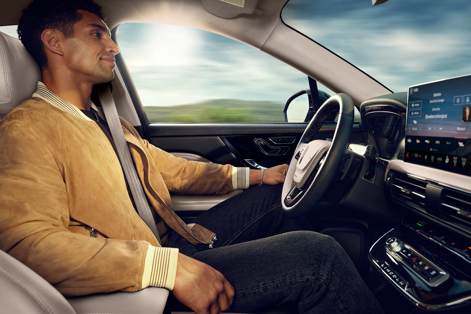 A man sitting in the driver seat of a 2025 Lincoln Corsair