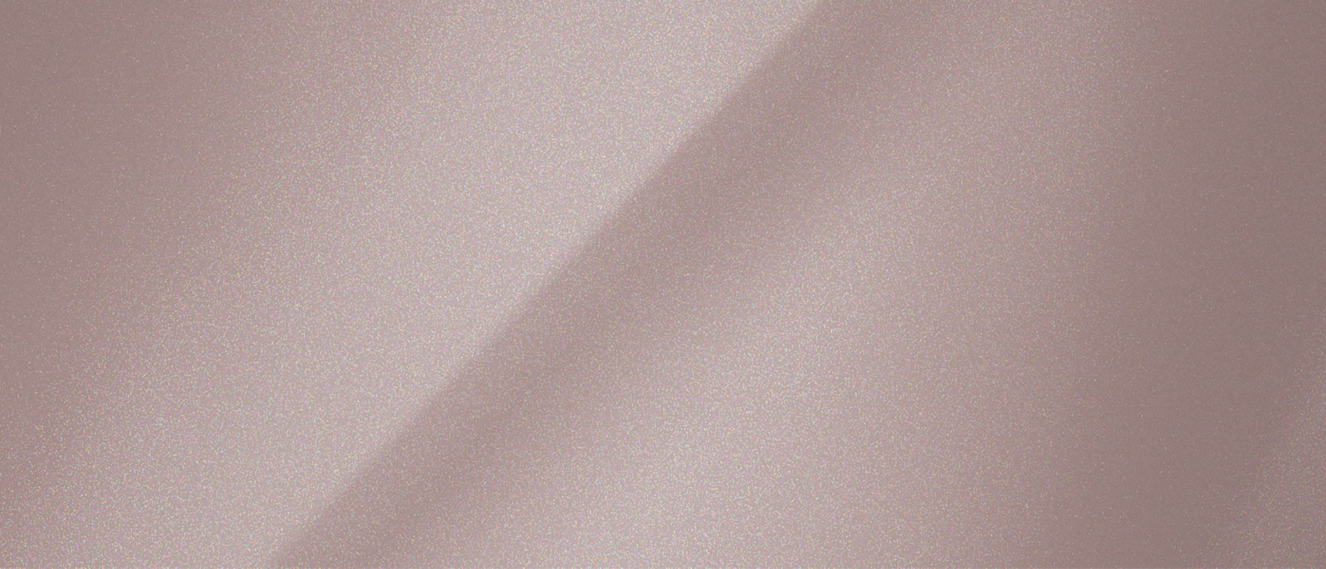 A colour chip representing the extra-cost Tinted Copper Metallic Clearcoat exterior colour