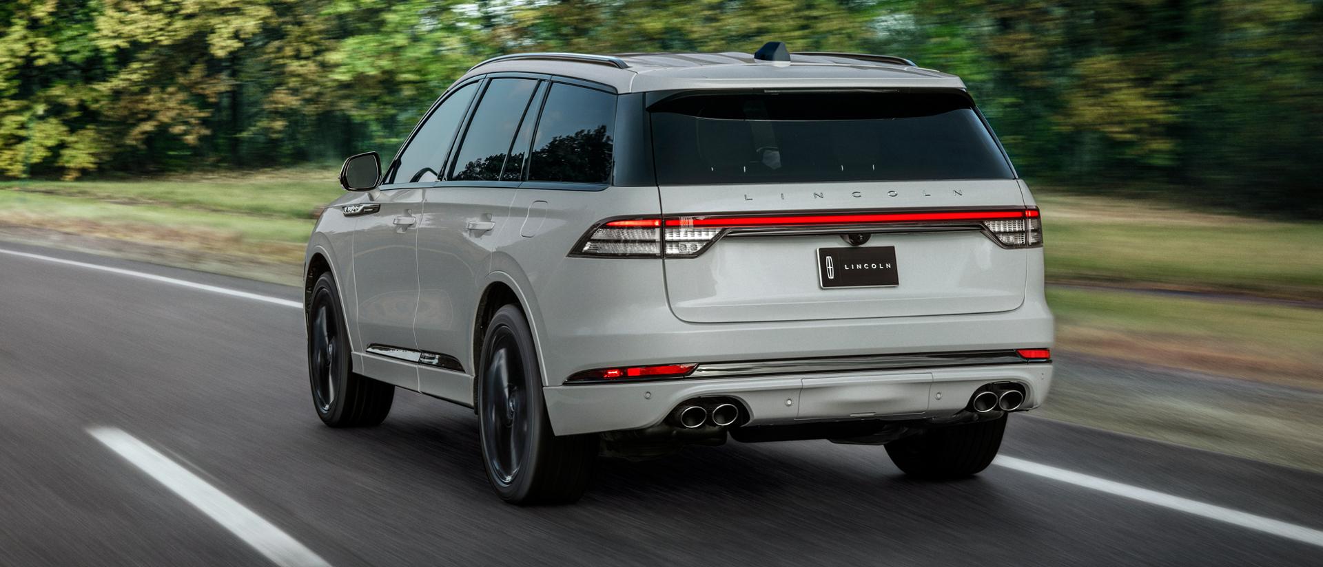 A 2027 Lincoln Aviator® is being driven on a country road