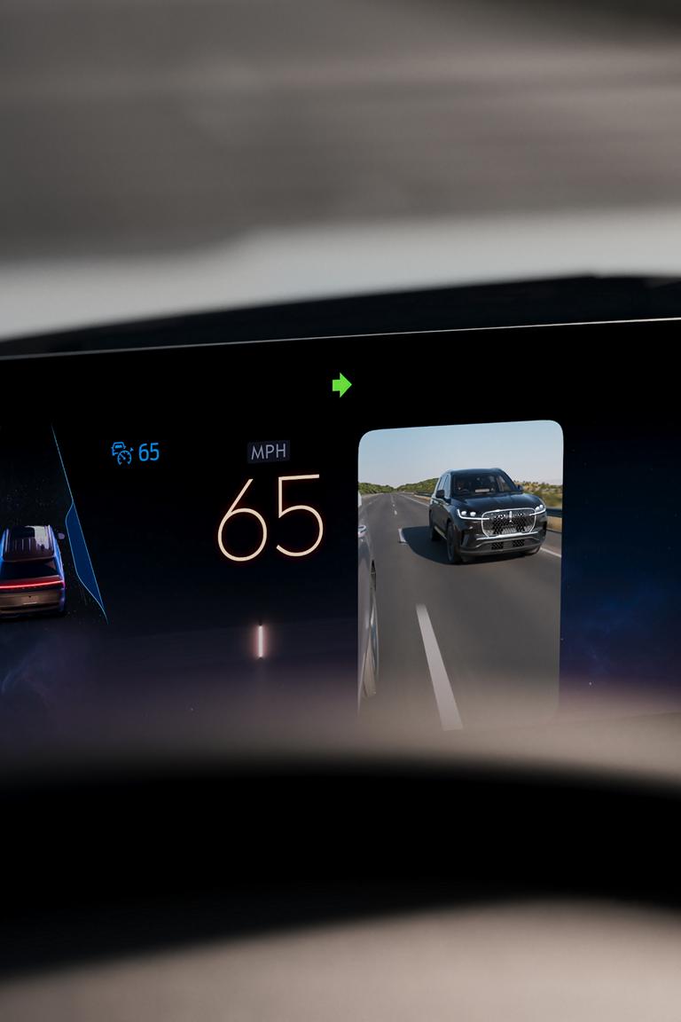 A 2026 Lincoln Navigator® SUV is being driven on a Hands-Free Blue Zone Highway