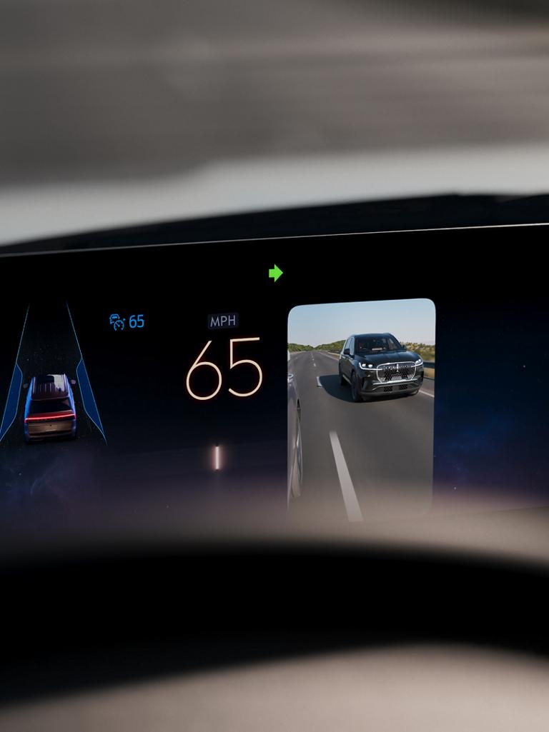 A 2026 Lincoln Navigator® SUV is being driven on a Hands-Free Blue Zone Highway