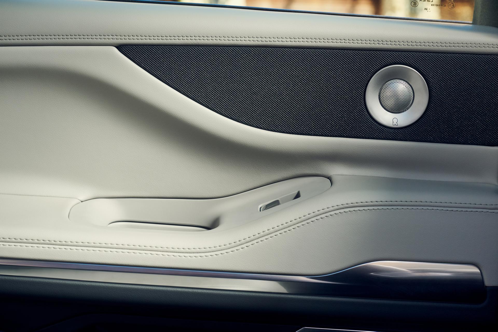 Revel® Ultima speakers are shown in the driver's door of a 2026 Lincoln Navigator® SUV