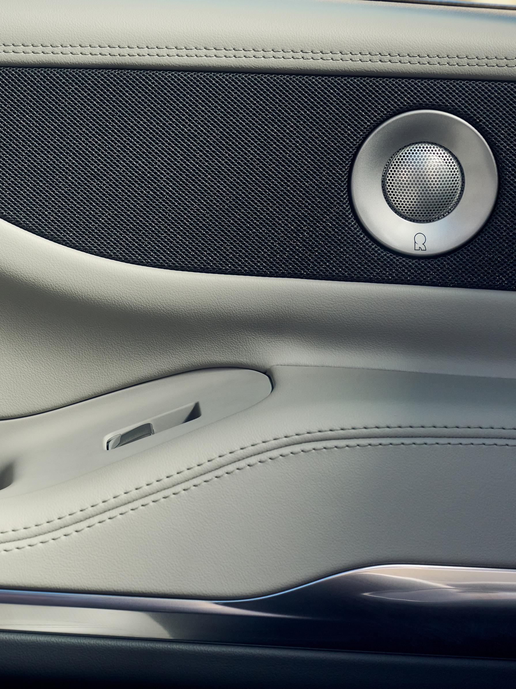 Revel® Ultima speakers are shown in the driver's door of a 2026 Lincoln Navigator® SUV