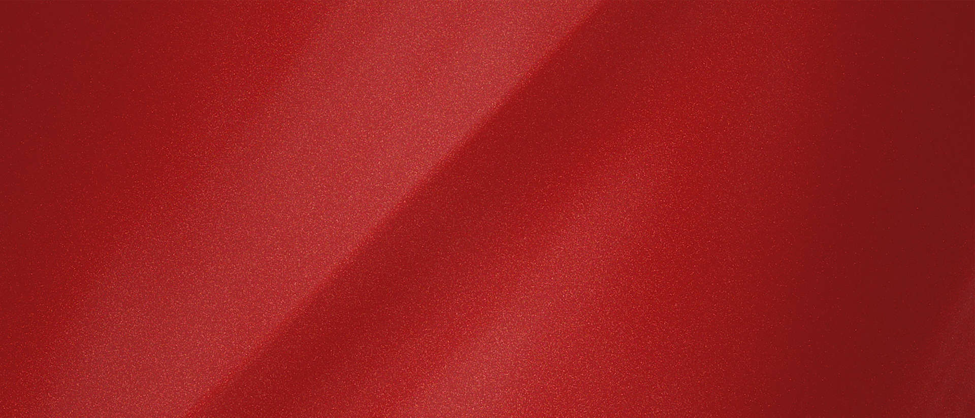 A colour chip representing the extra-cost Chroma Flame Red Metallic Clearcoat exterior colour