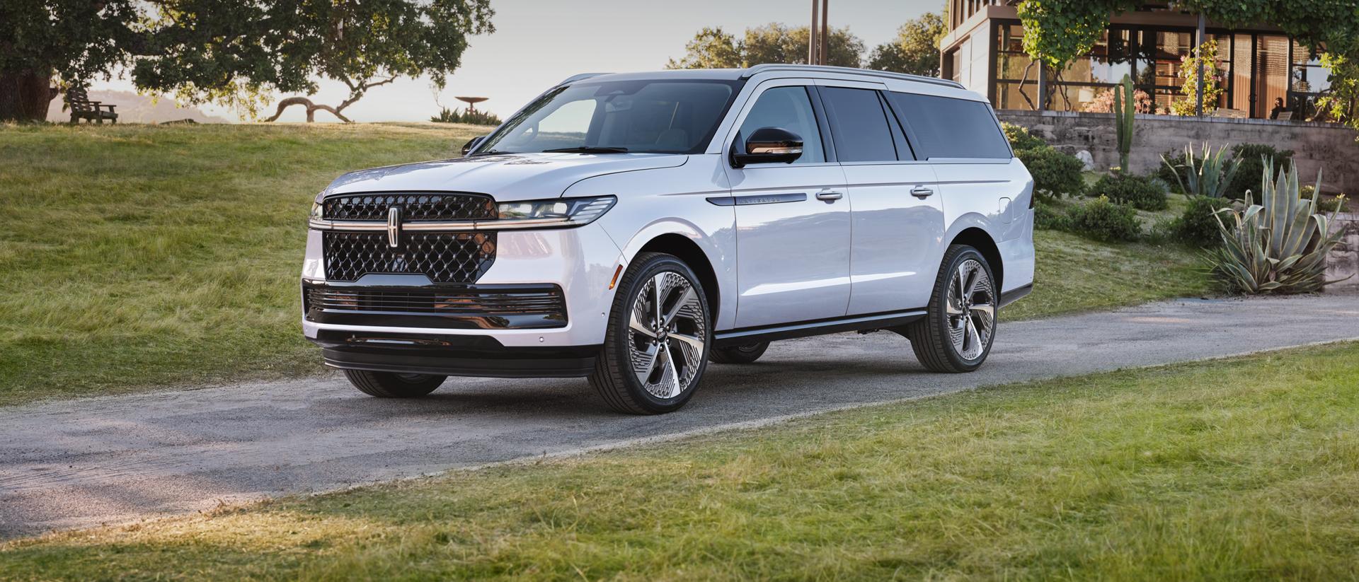 2026 Lincoln Navigator SUV parked in front of a modern house.