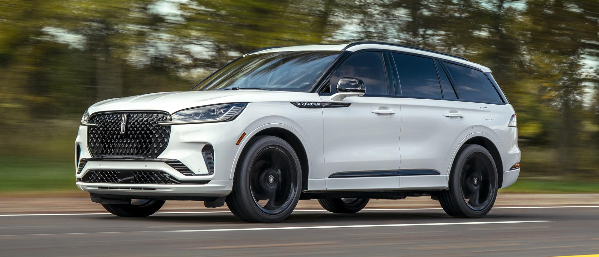 A 2026 Lincoln Aviator® is being driven on a country road