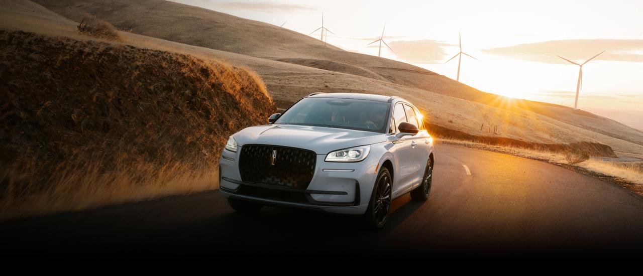 The Lincoln Corsair driving down a curvy road.