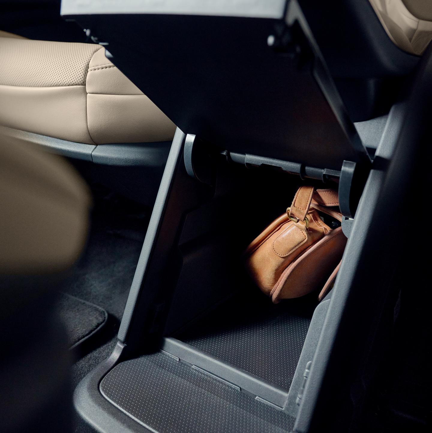 The available second-row console provides convenient storage to safely stow small personal items