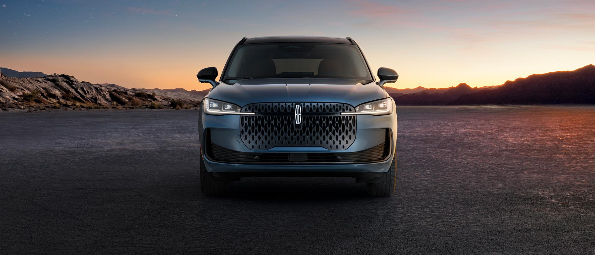 The 2027 Lincoln Corsair parked infront of a mountain range.