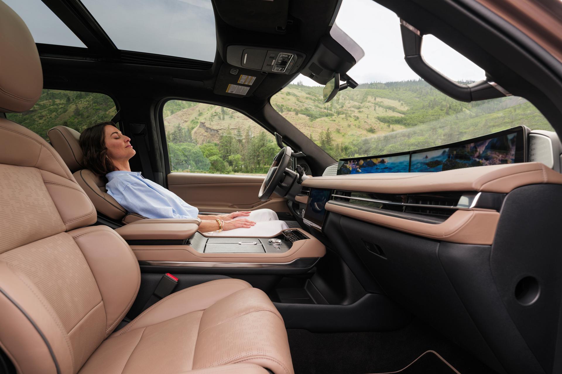 A woman in the driver's seat of her 2026 Lincoln Black Label Navigator® enjoys the Rejuvenate feature