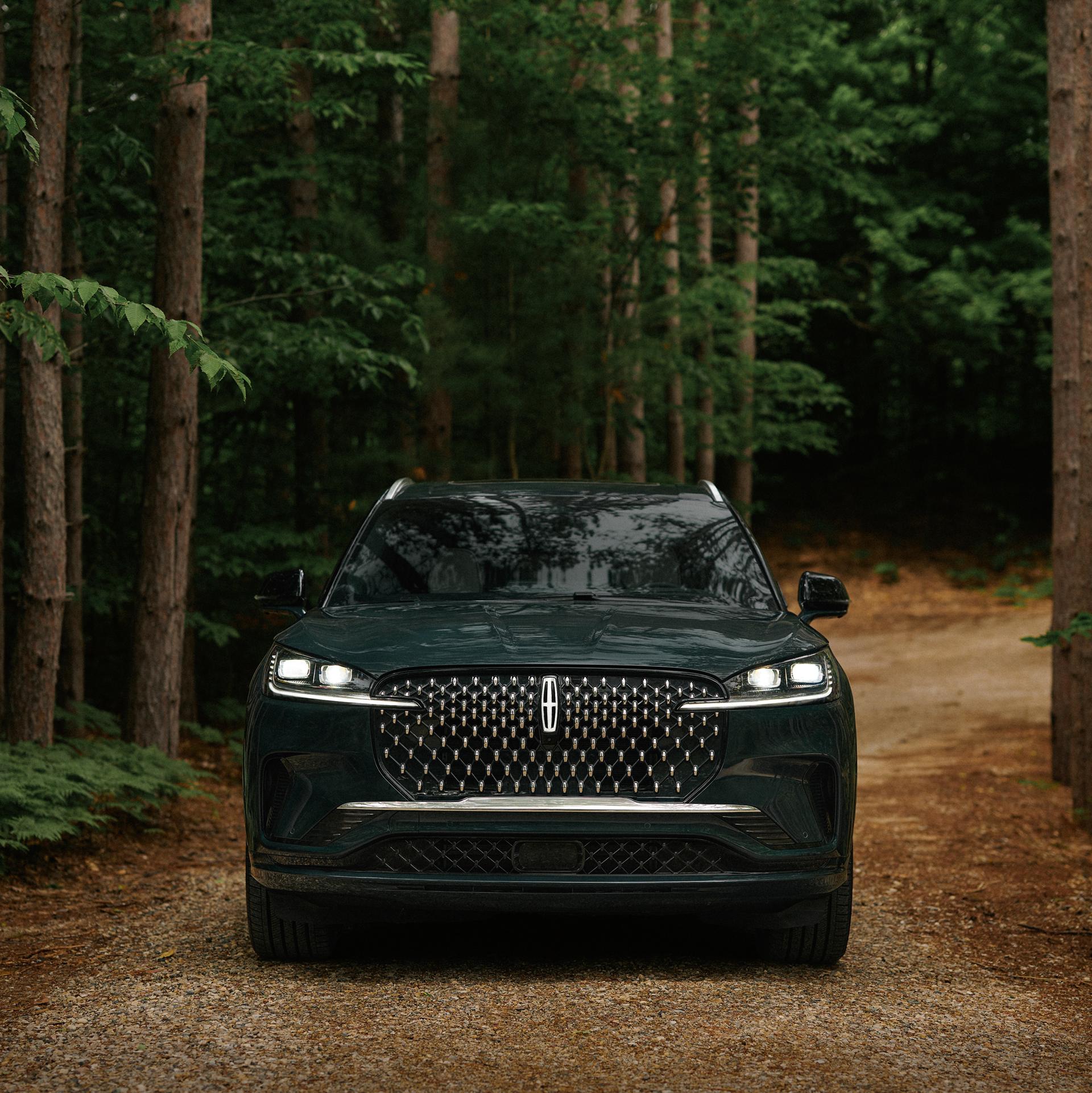 A 2027 Lincoln Aviator® is being driven on a country road