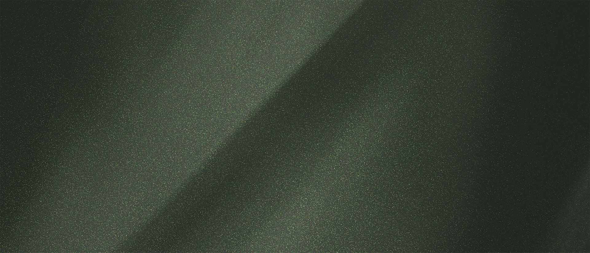 A colour chip representing the extra-cost Manhattan Green Metallic Clearcoat exterior colour