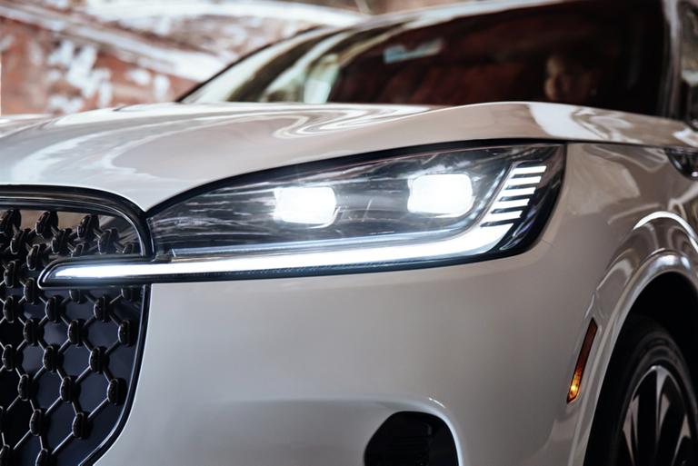 The front left headlamp of a 2026 Lincoln Aviator® SUV is shown