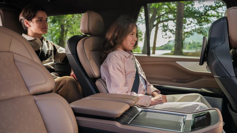 Children safely occupy the second and third row of a 2027 Lincoln Navigator® SUV