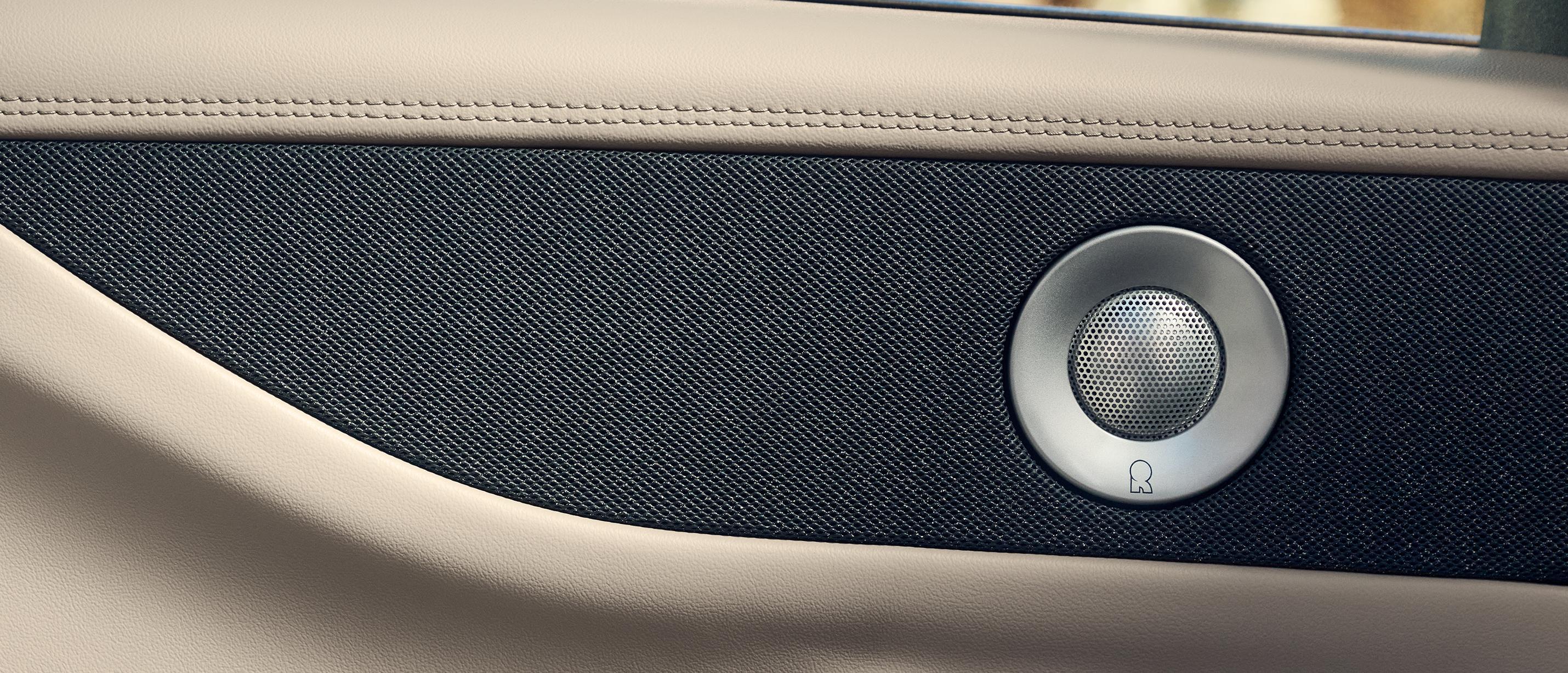 The rear passenger door of a 2027 Lincoln Navigator® SUV with an embedded speaker