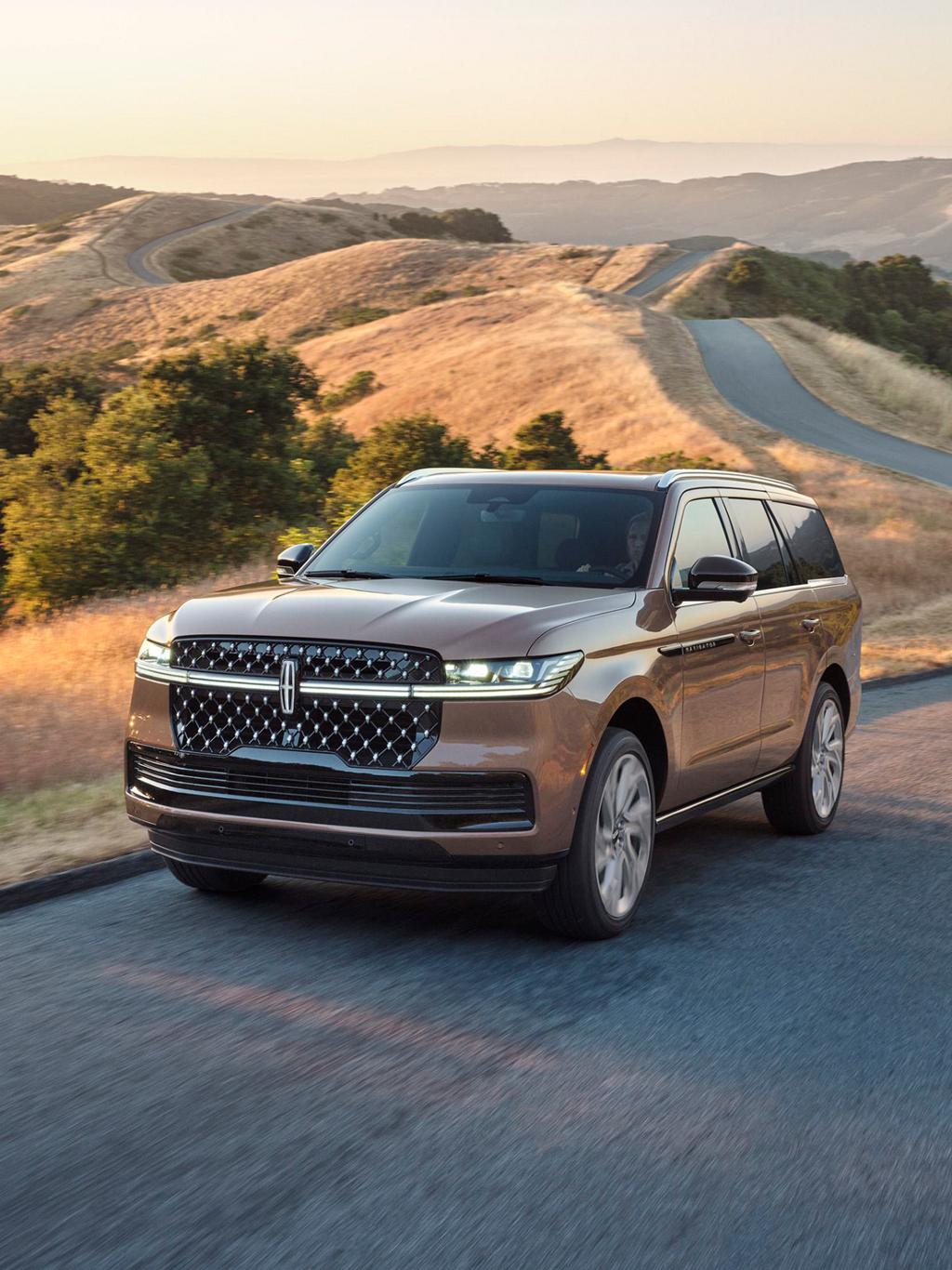 The Lincoln Black Label Navigator driving down a road.