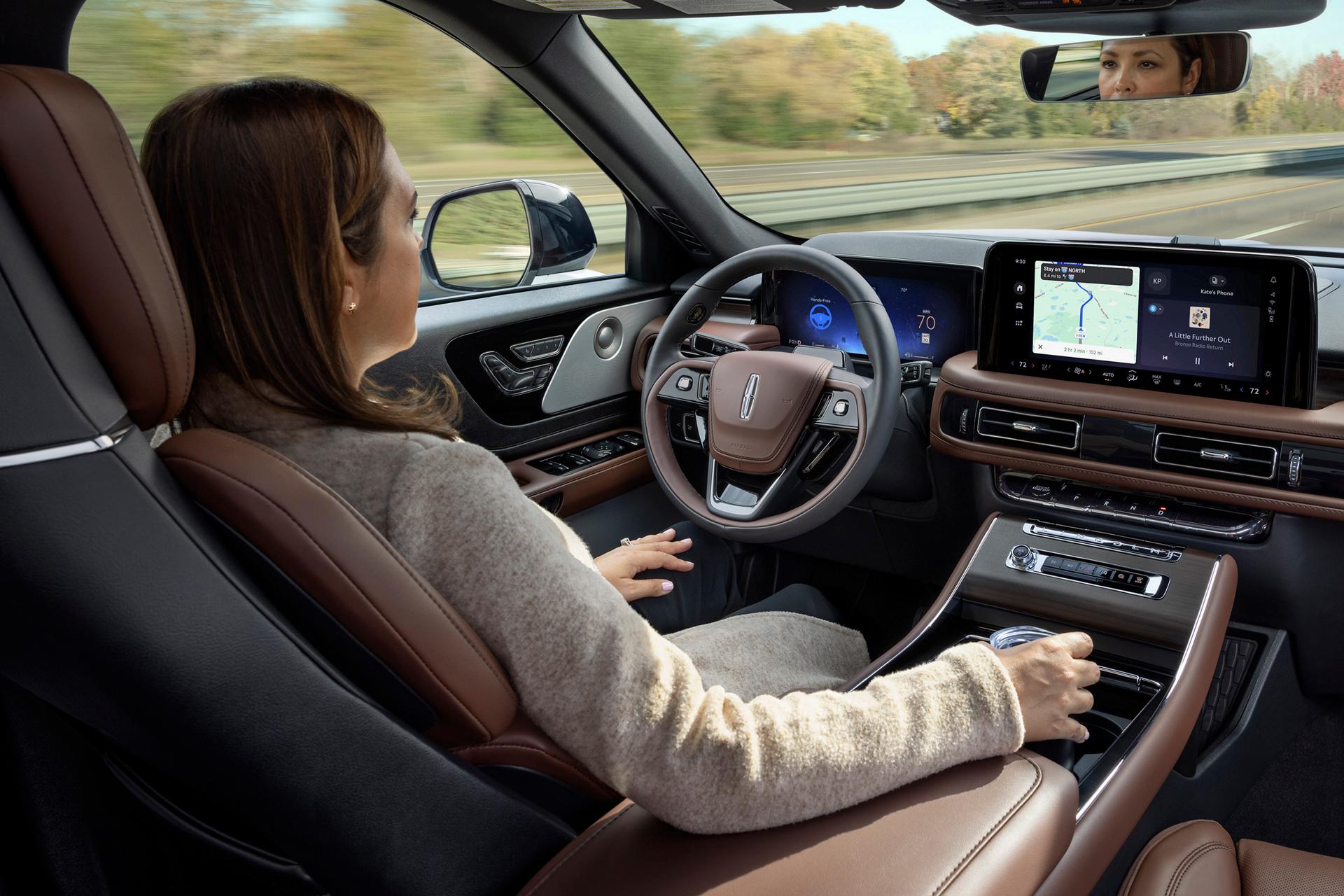 A driver of a 2027 Lincoln Aviator® safely enjoys hands-free highway driving