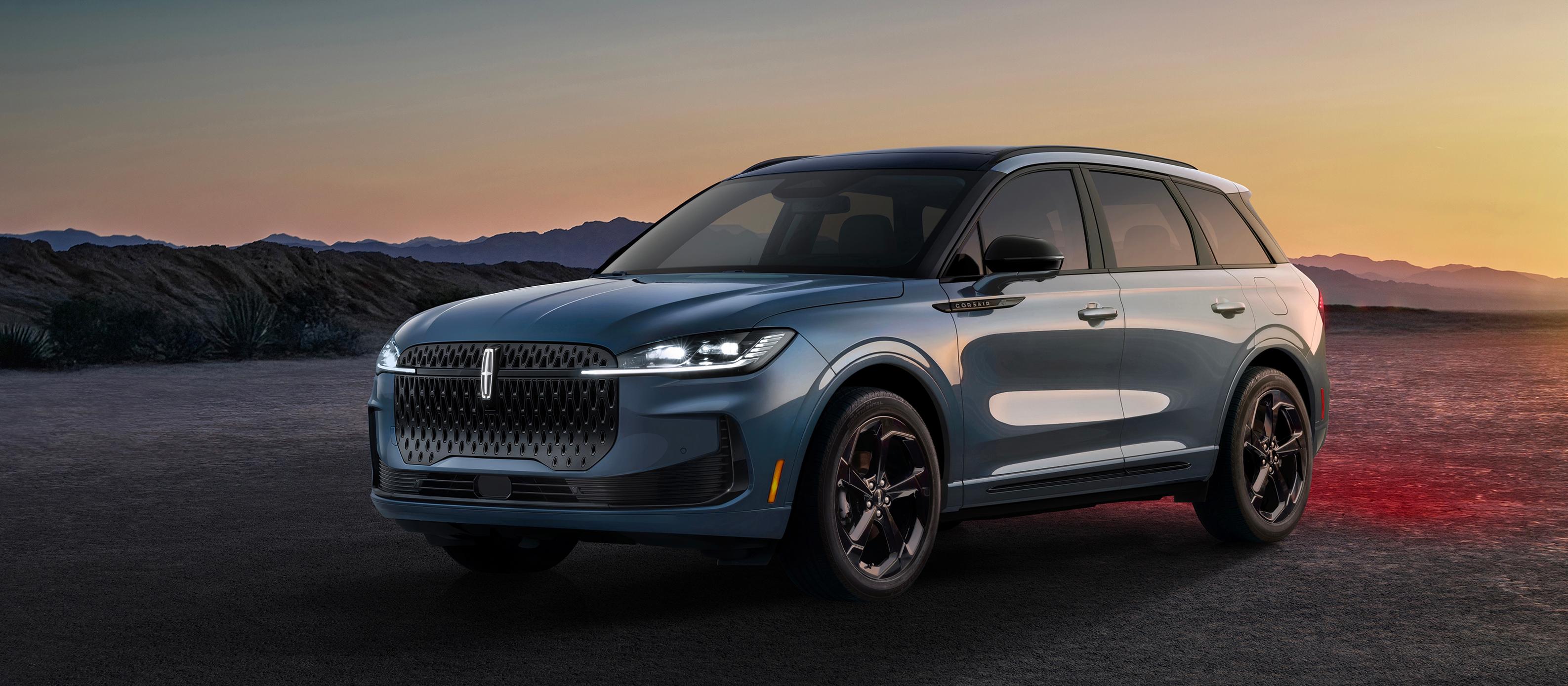 The thoughtfully crafted 2027 Lincoln Corsair® Hybrid parked against a dramatic desert backdrop at twilight.
