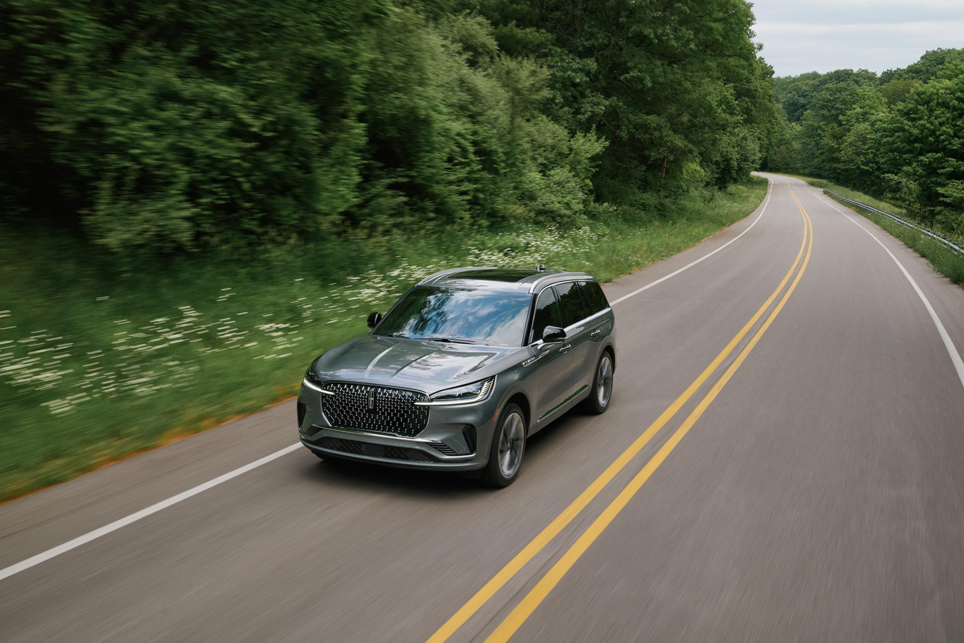 A 2027 Lincoln Aviator® is being driven on a country road