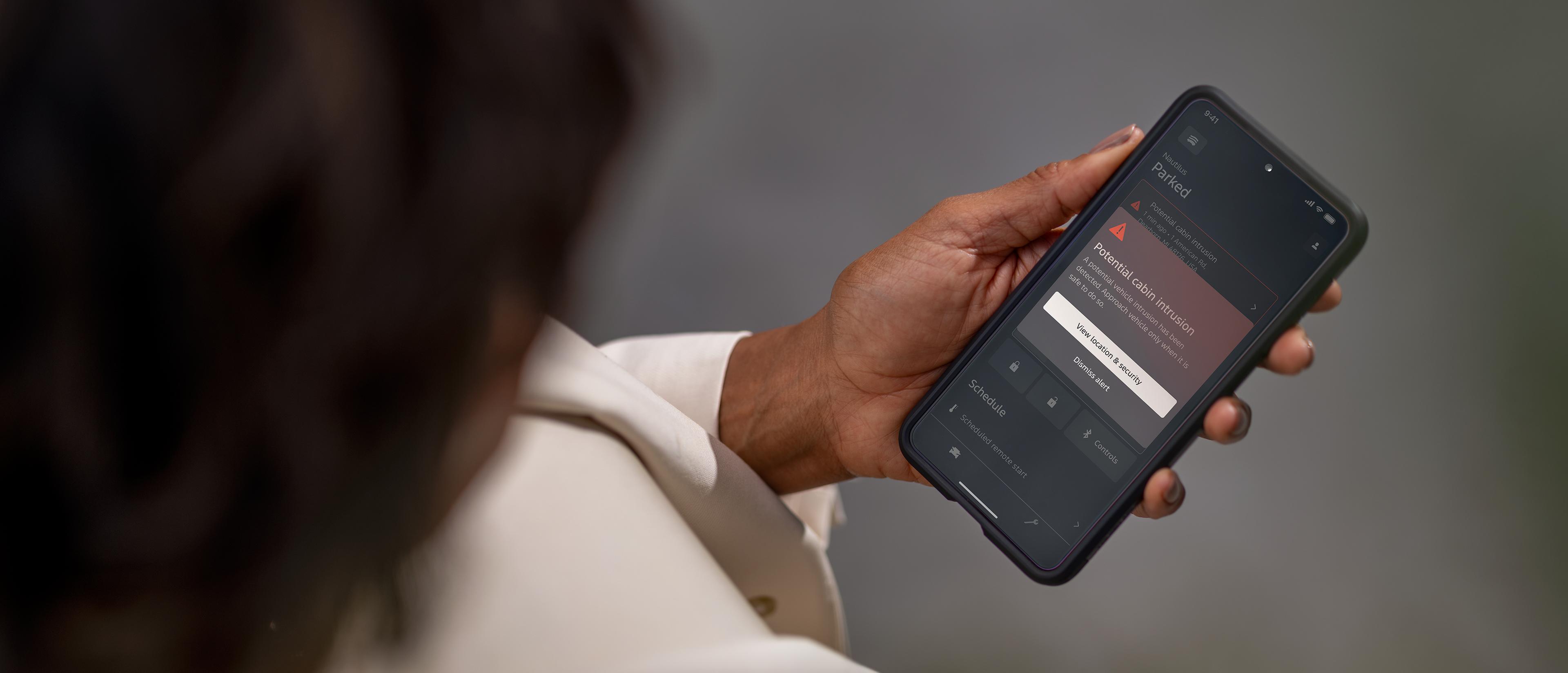 A person accesses security features on smartphone app