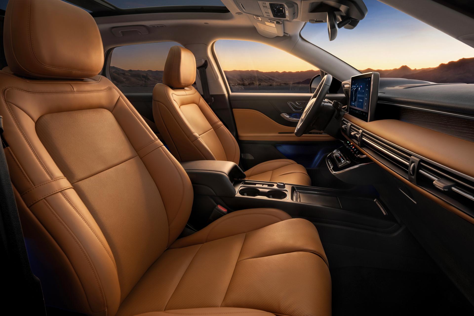The interior of a 2027 Lincoln Corsair® Hybrid featuring Perfect Position front seats