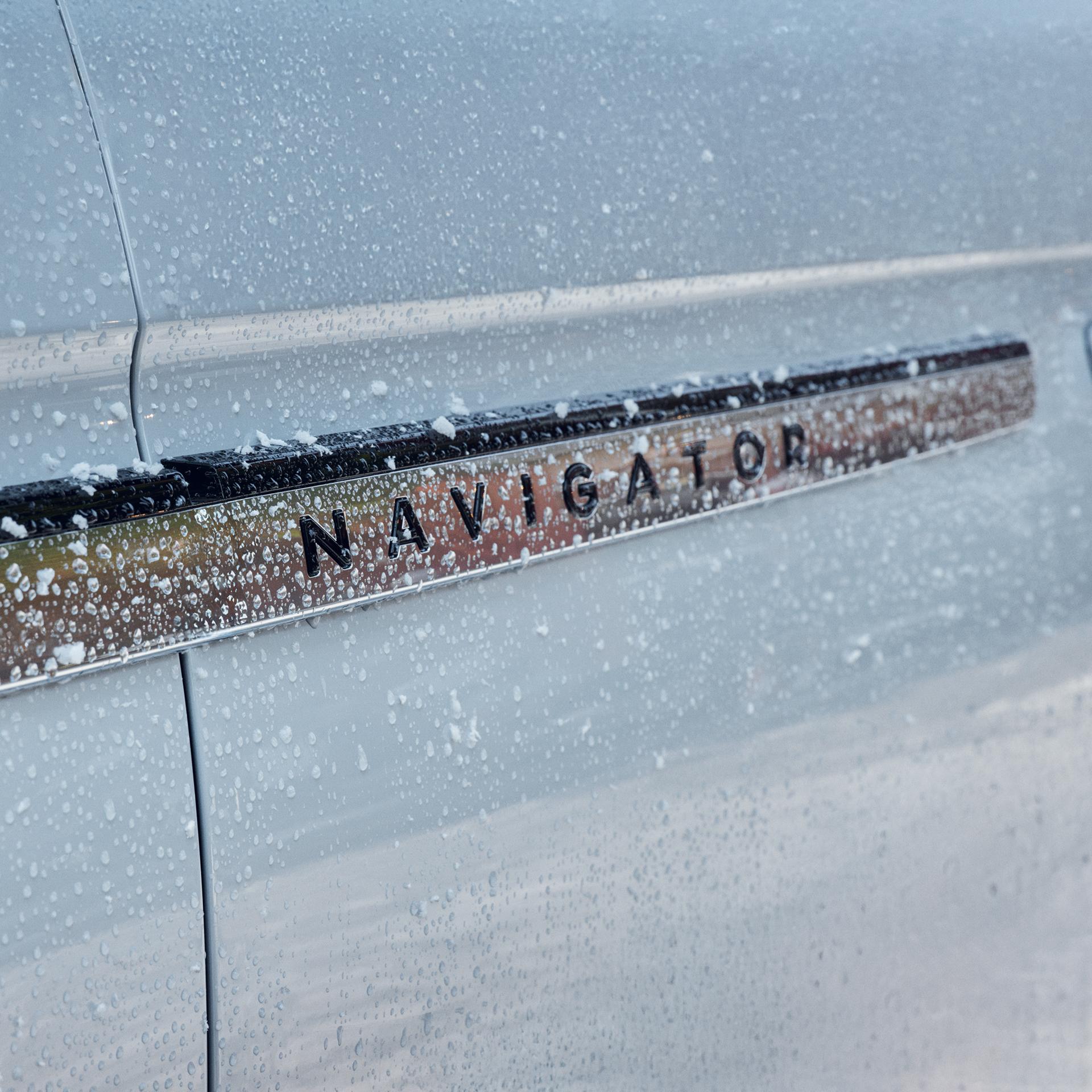 The Navigator name badge on the driver's door of a 2027 Lincoln Navigator® SUV
