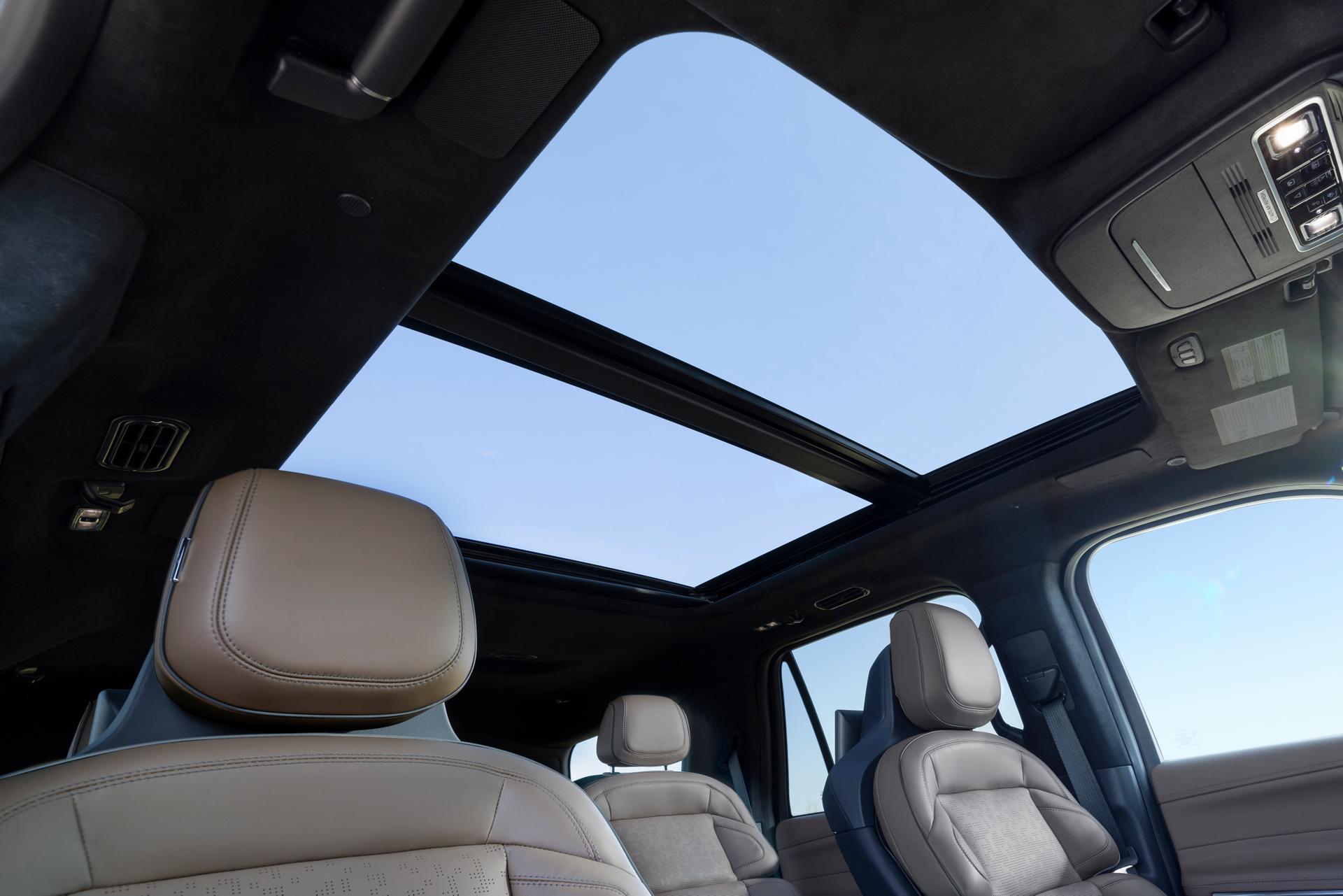A low interior shot of the 2027 Lincoln Navigator® SUV shows the large Panoramic Vista® roof