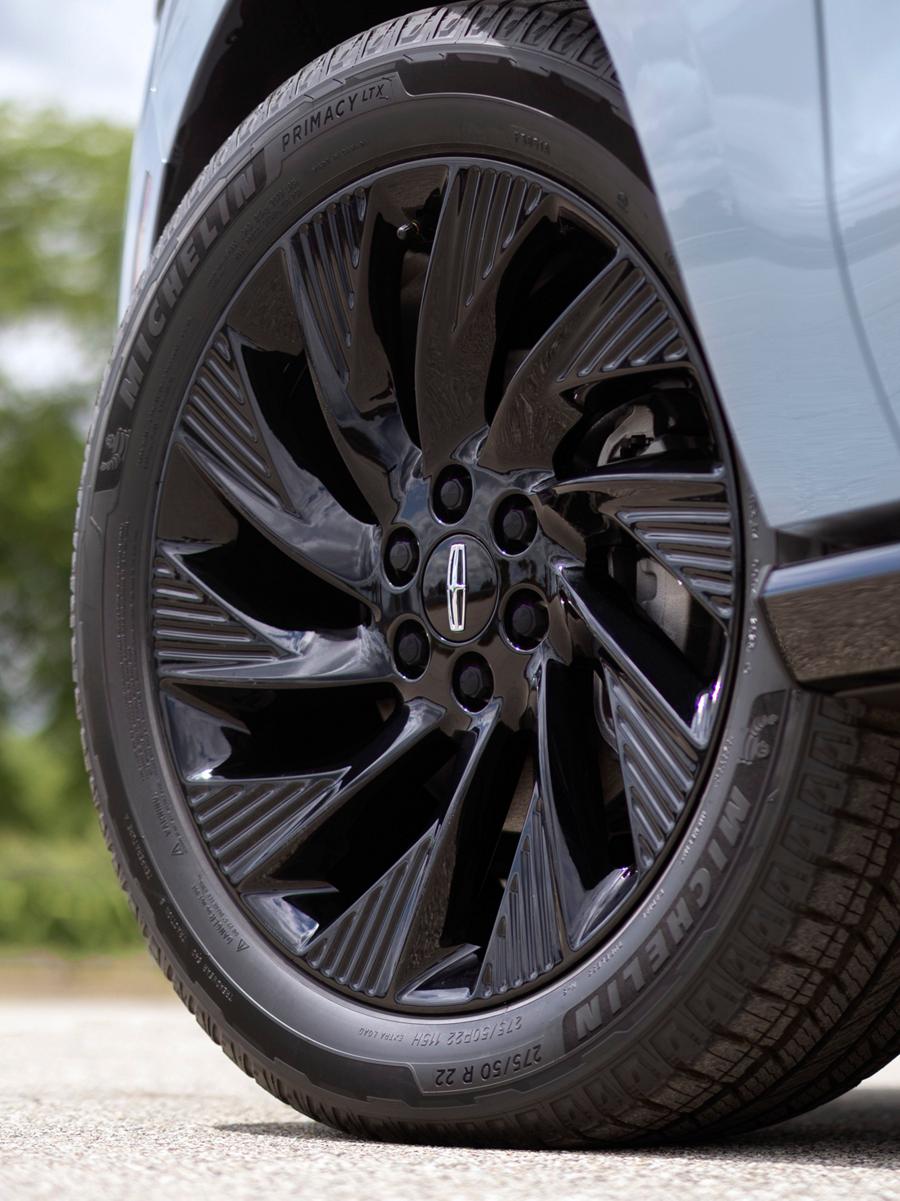 Close-up of a Lincoln vehicle wheel and tire.