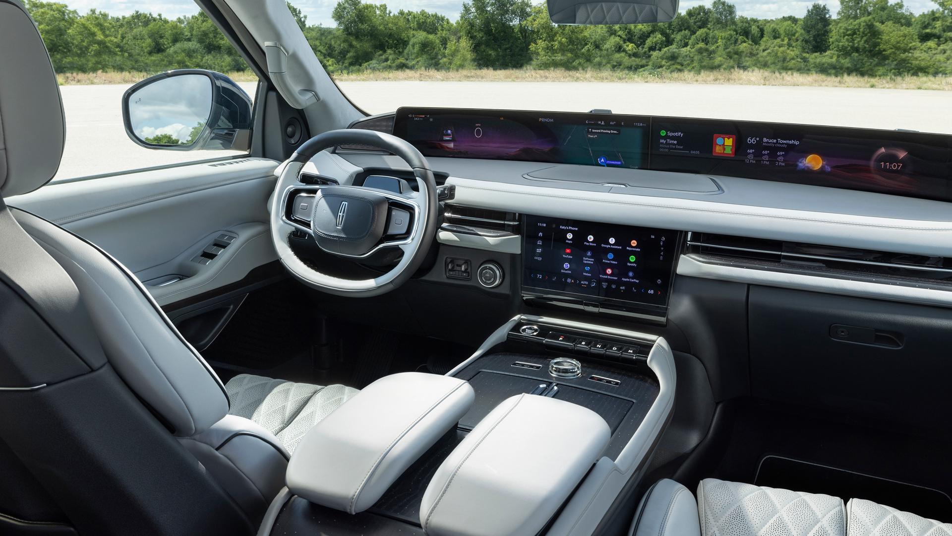 An angled shot of the interior front of a 2026 Lincoln Black Label with the Atmospheric theme