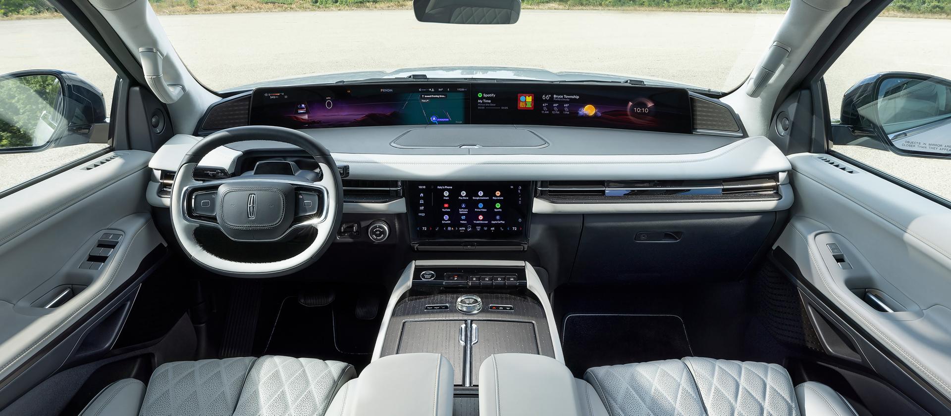 The panoramic display spans the width of a 2025 Lincoln Black Label Navigator® SUV with the Atmospheric interior theme