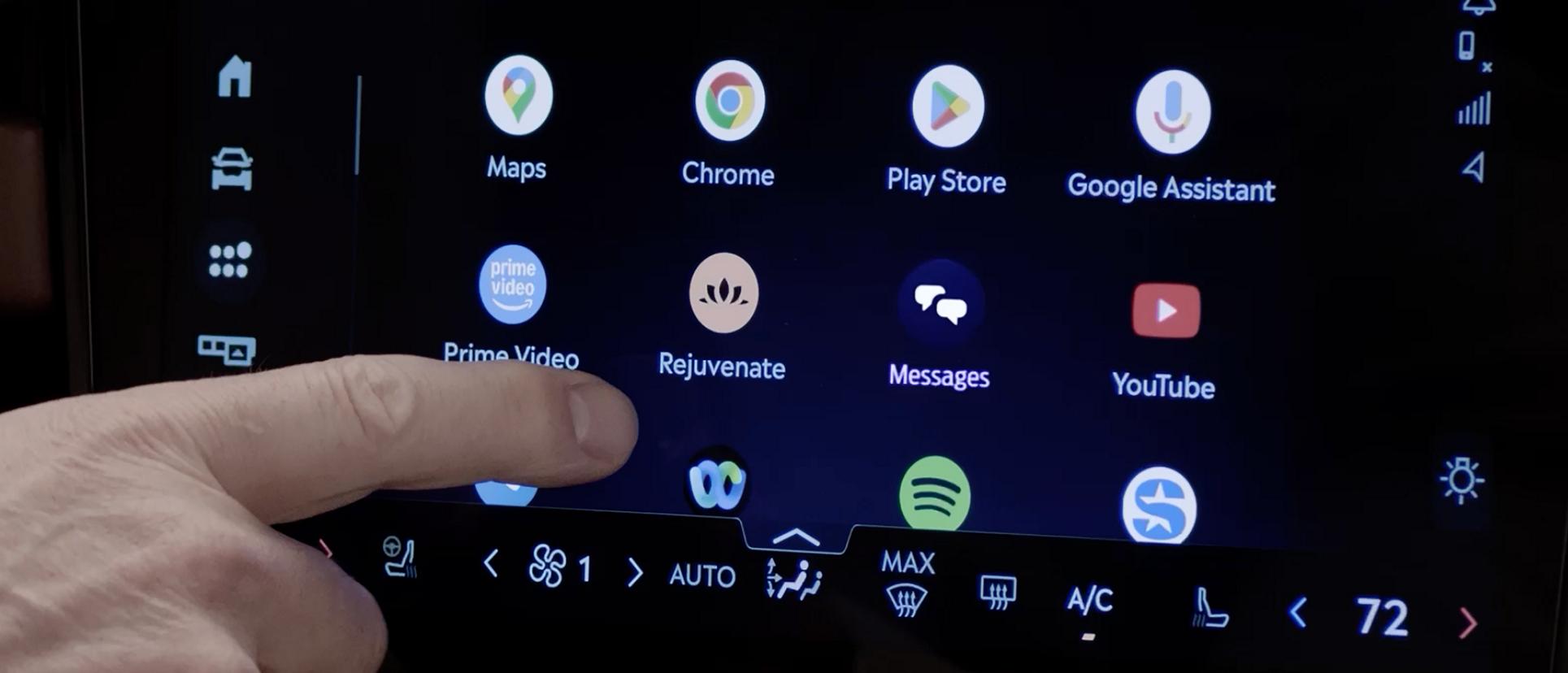 A finger about to press the centre touchscreen of a 2027 Lincoln Navigator® SUV