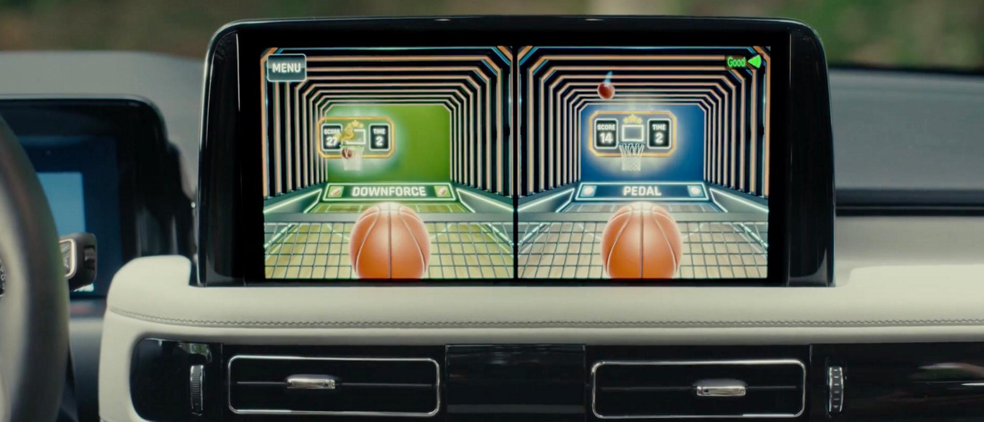 Children enjoy in-vehicle gaming from the second row of a parked 2027 Lincoln Aviator®