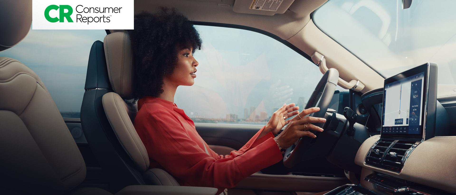 Consumer Reports logo. A woman in a Lincoln vehicle utilizing BlueCruise technology